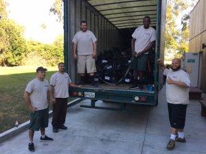 movers standing by packed truck